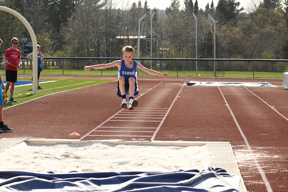 Student Athlete Competing In Long Jump 