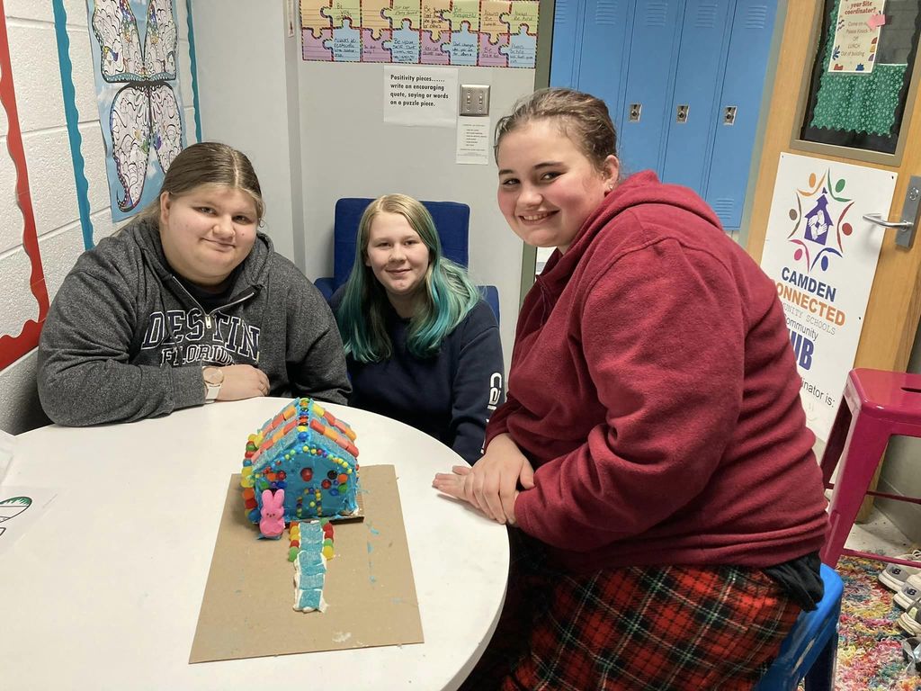 Three Students With Their Candy House